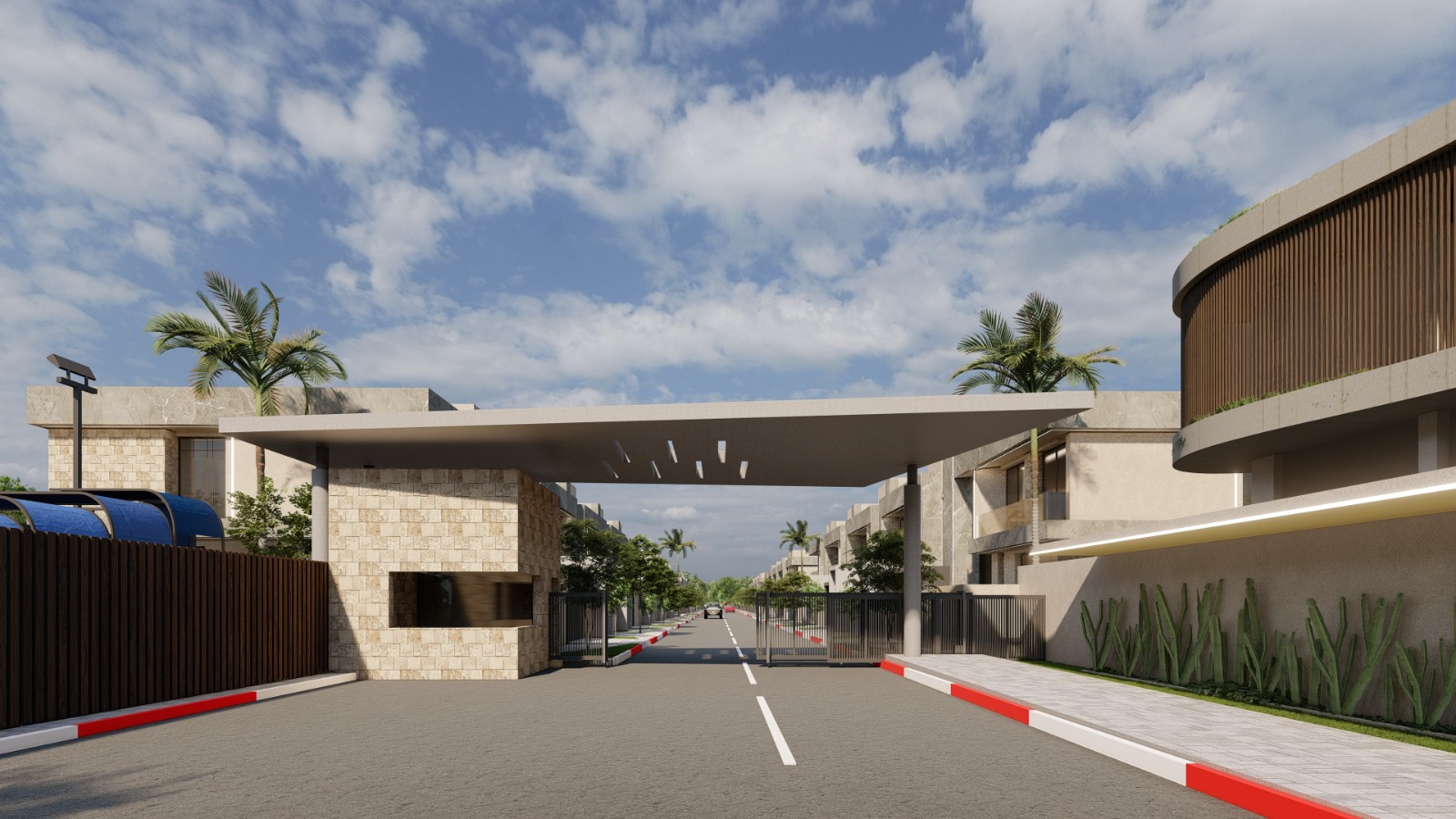 Entrée sécurisée du domaine Alhambra Villas avec portail gardé, barrières de sécurité, murs en pierre, palmiers et architecture moderne résidentielle à Marrakech